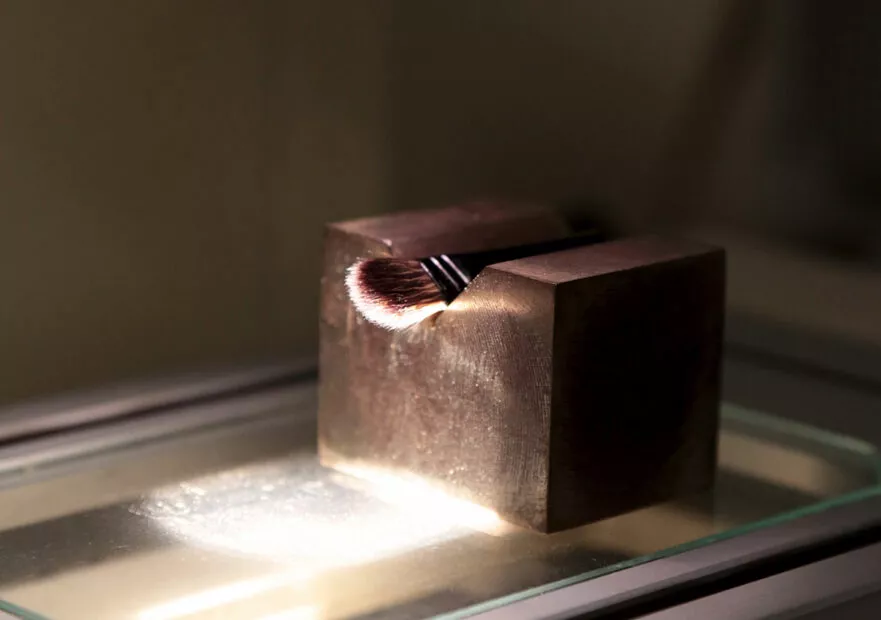 Brush under precision optical measurement during quality control process